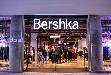 19 December 2019-Bucharest, Romania. The store front of Bershka fashion, a designer and retailer with people shopping for Christmasのeditorial素材
