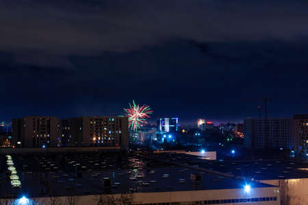 01 January 2021- Bucharest, Romania. The fireworks seen from the window above the city made by the peopleのeditorial素材