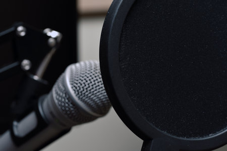 Close up on a microphone protected by a pop filterの写真素材