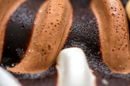 Macro close up on a profiterol ice cream with vanilla and chocolateの写真素材