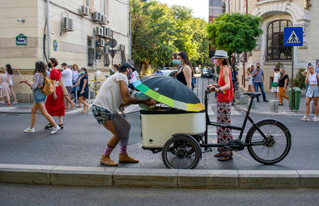 14.08.2021 Romania - Bucharest PRIDE LGBT FESTIVAL guys, girls, queers and gender diversity wave rainbow flag at Gay Pride parade. Bucharestのeditorial素材