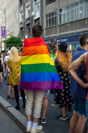 14.08.2021 Romania - Bucharest. People holding the rainbow flags and banners as they reachh the University square in the march at the lgbt, pride parade.のeditorial素材