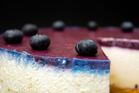 Unbaked blueberry cheesecake on an empty space with close upsの写真素材
