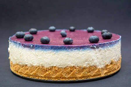 Unbaked blueberry cheesecake on an empty space with close upsの写真素材