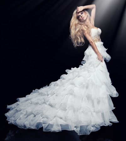 Sexy blond woman in white dress の写真素材