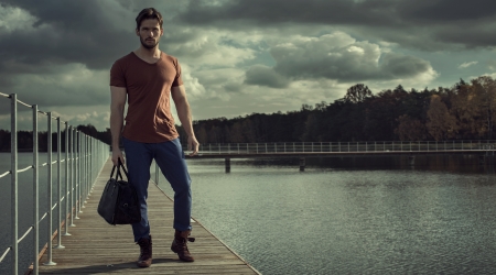 Panoramic photo of handsome man and nature as backgroundの写真素材