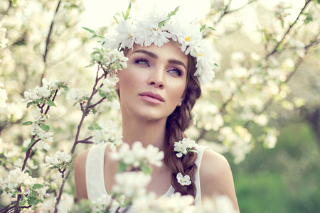 Portrait of young beautiful woman in the gardenの写真素材