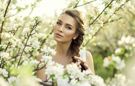 Portrait of beautiful natural woman make hair braidの写真素材