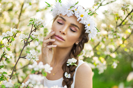 Close-up portrait of young closing eyes woman's face with clean fresh skinの写真素材