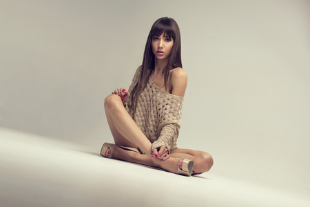 Young brunette woman in studioの写真素材
