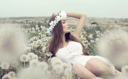 Young girl resting on a meadowの写真素材