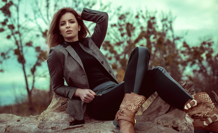 Fashion woman outdoor in autumn sceneryの写真素材