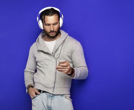 Portrait of young handsome man with headphonesの写真素材