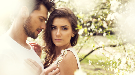 Sensual couple touching each other in the gardenの写真素材