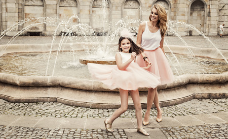 Mother and daughter having fun in same outfits weared tutu skirtsの写真素材