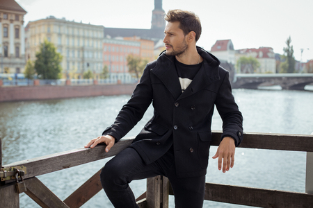 Young model in black coatの写真素材