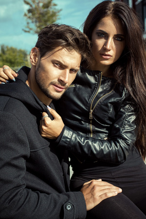 Sexy couple in leather jacket hugging each otherの写真素材