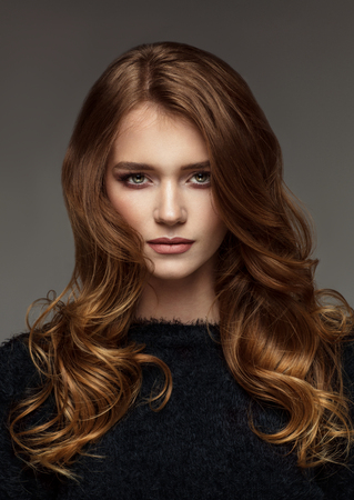 Portrait of young woman with dramatic lookの写真素材