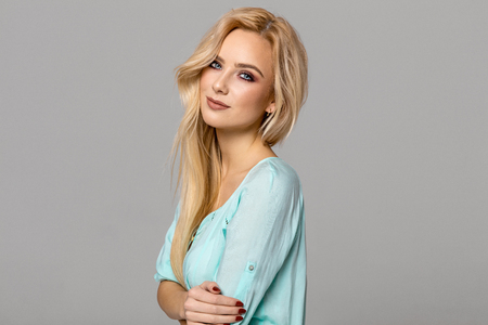 Portrait of blond female model with blue eyesの写真素材