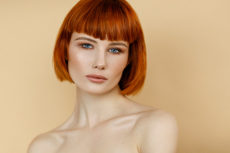 Portrait of female woman with red hair and natural skin textureの写真素材