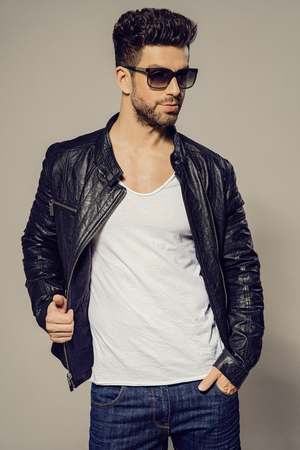 Sexy man wear leather jacket and sunglassesの写真素材
