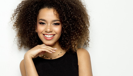 Portrait of young black woman isolated on whiteの写真素材