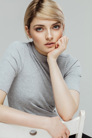 Portrait of of fashion model with natural skin isolated on greyの写真素材