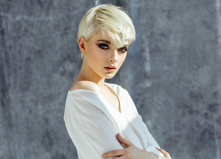 Portrait of beautiful young female model posing in daylightの写真素材
