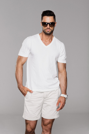 Handsome man in summer clothes wear sunglassesの写真素材