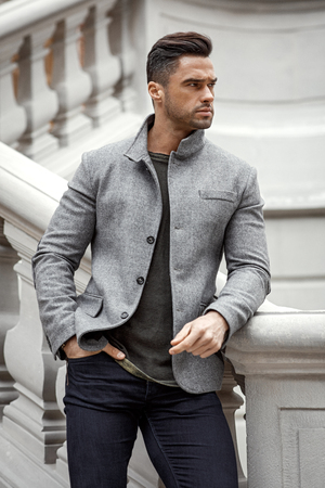 Handsome man in gray jacketの写真素材