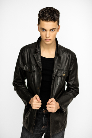 Sexy young man in black jacketの写真素材