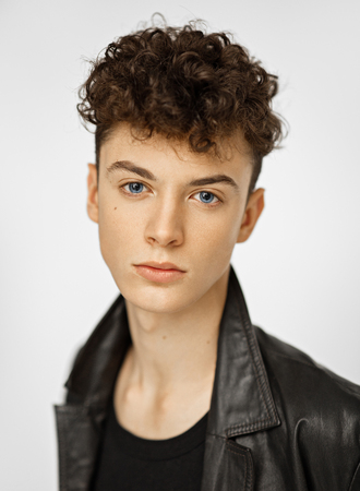 Close-up portrait of young handsome boyの写真素材
