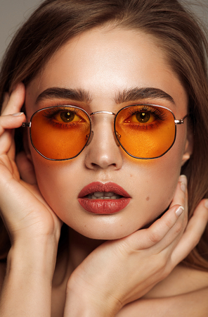 Close up face of young girl wear sunglassesの写真素材