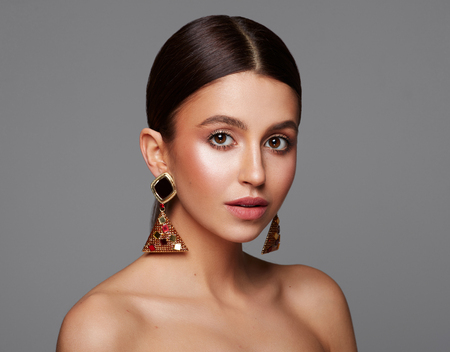 Beauty portrait of young attractive woman weaig stylish earringsの写真素材