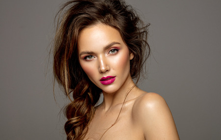 Beauty portrait of female model with messy hair and braidの写真素材