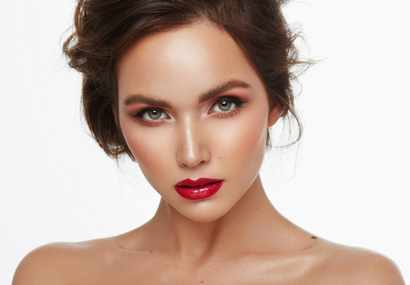 Close-up face of beautiful young girl with clean skin isolated over white backgroundの写真素材