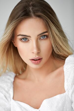 Close-up face of young beautiful blonde womanの写真素材