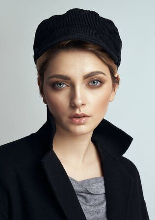 Portrait of sexy young woman with beautiful eyes isolated on grayの写真素材