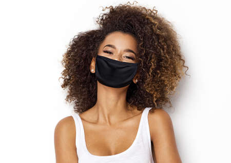 Beautiful african american girl with an afro hairstyle smilingの写真素材