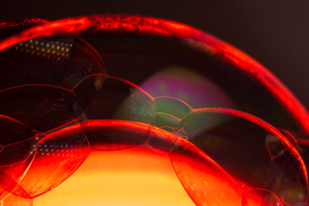 Red soap bubbles with a red core like the sun