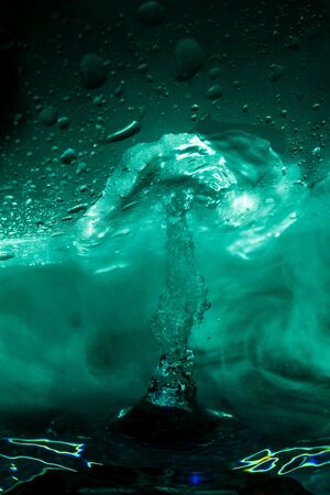 Water geyser hits glass imitate explosionの写真素材