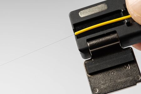 optical fiber welding workflow, cable laying in holders, close-upの写真素材