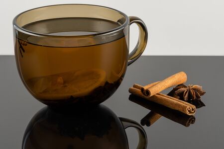 Tea with lemon. star anise and cinnamon sticksの写真素材