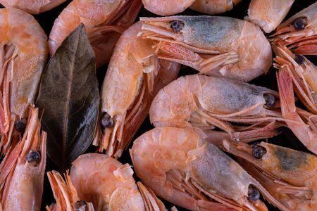 Boiled shrimp on black glassの写真素材