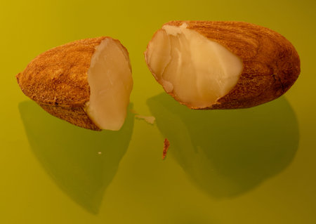 Macro chopped almonds on green glass
