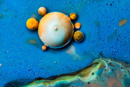 Macro universe, platnets and stars in it, multi-colored paints. Universe in a plate.の写真素材