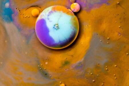 Macro universe, platnets and stars in it, multi-colored paints. Universe in a plate.の写真素材