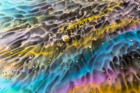 Macro universe, acrylic multi-colored paints, amazing texture, paints in water. Universe in a plate.の写真素材
