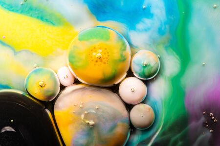 Macro universe, platnets and stars in it, multi-colored paints. Universe in a plate.の写真素材