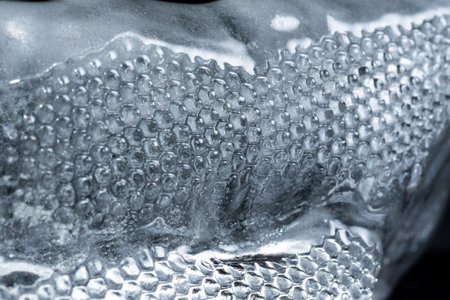 Abstraction and imitation of an iceberg, ice with snow and rain with patterns, macro photo